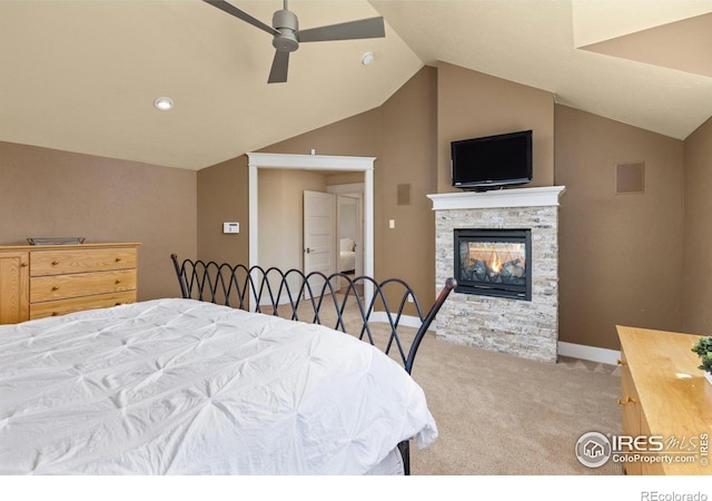 245 Spruce St, Louisville, CO 80027 - carpeted bedroom featuring lofted ceiling, a stone fireplace, baseboards, visible vents, and ceiling fan