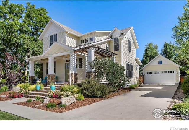 245 Spruce St, Louisville, CO 80027 - view of front facade featuring covered porch, an outdoor structure, and a detached garage