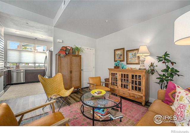 living room featuring visible vents and light wood-style floors