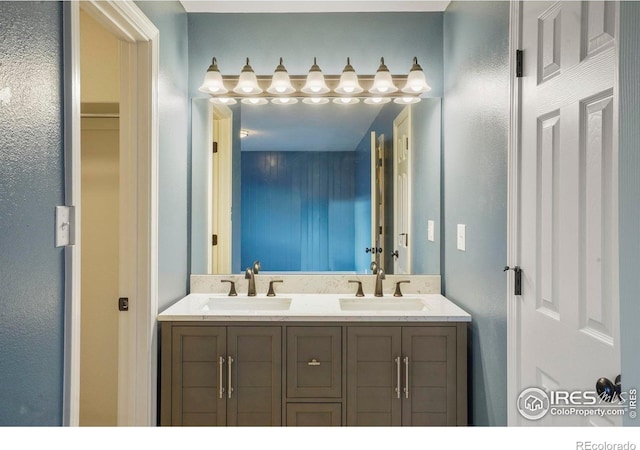 1458 Friendship Ln W, Colorado Springs, CO 80904 - bathroom featuring double vanity and a sink