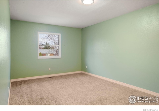 1458 Friendship Ln W, Colorado Springs, CO 80904 - empty room featuring carpet floors, baseboards, and visible vents