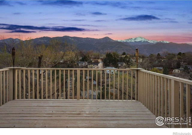 1458 Friendship Ln W, Colorado Springs, CO 80904 - deck at dusk featuring a mountain view