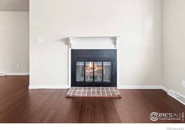 422 38th Ave, Greeley, CO 80634 - details featuring baseboards, wood finished floors, and visible vents