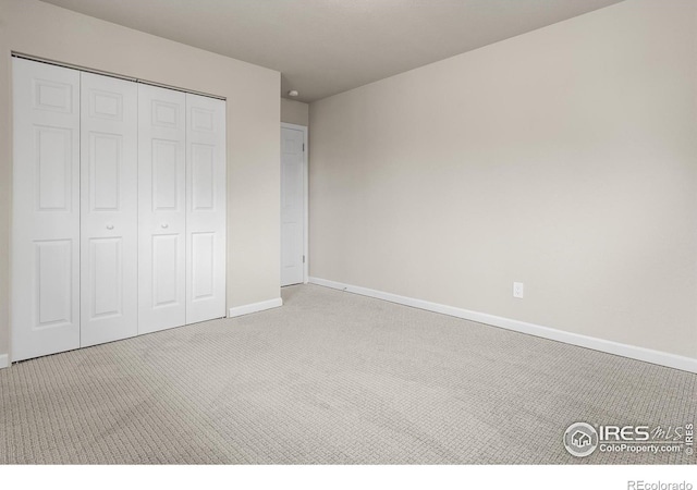 422 38th Ave, Greeley, CO 80634 - unfurnished bedroom featuring baseboards, carpet, and a closet