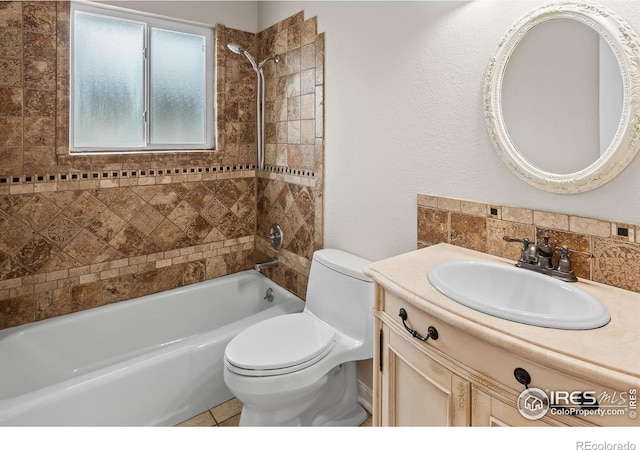 422 38th Ave, Greeley, CO 80634 - bathroom featuring shower / tub combination, backsplash, toilet, and vanity