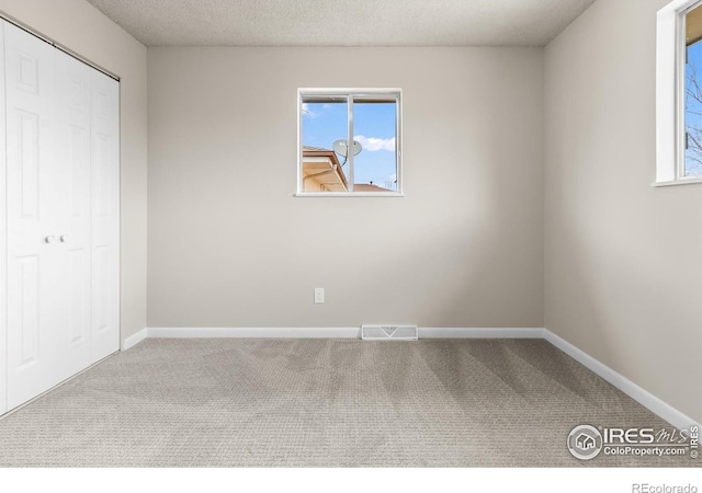 422 38th Ave, Greeley, CO 80634 - unfurnished bedroom featuring visible vents, carpet flooring, and baseboards
