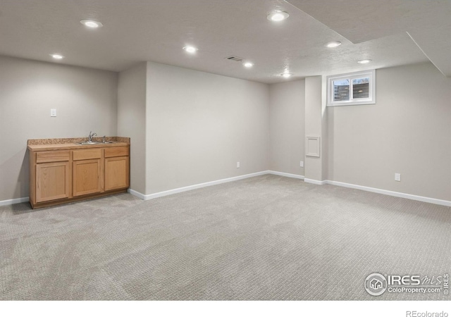 422 38th Ave, Greeley, CO 80634 - below grade area featuring light colored carpet, recessed lighting, and baseboards