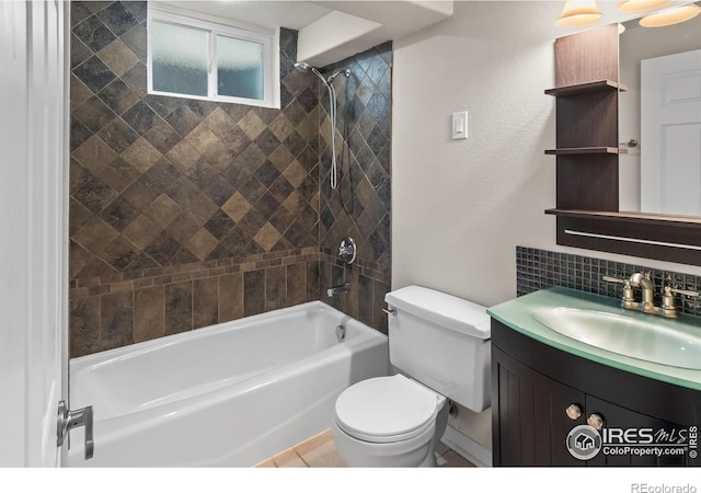422 38th Ave, Greeley, CO 80634 - bathroom featuring decorative backsplash, toilet, bathing tub / shower combination, and vanity
