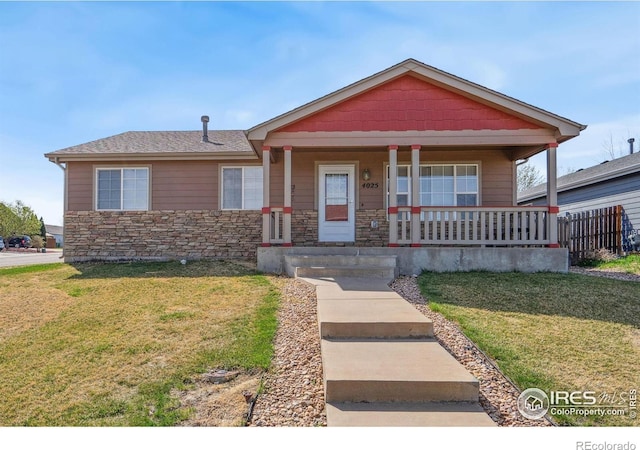 bungalow-style house with roof with shingles, a porch, stone siding, and a front lawn