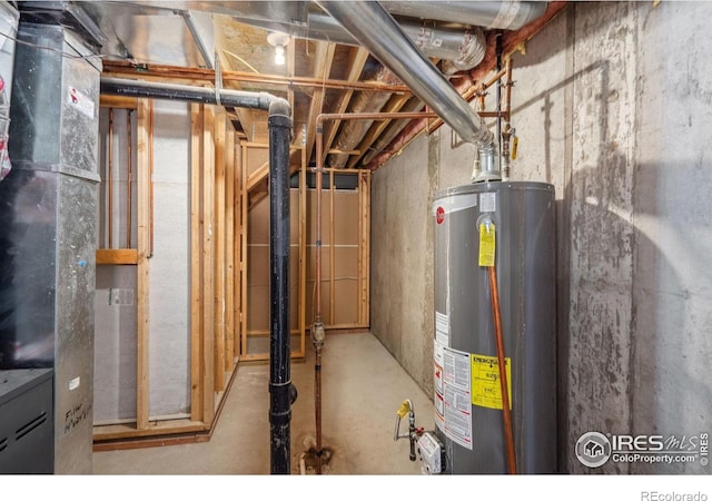 utility room featuring water heater