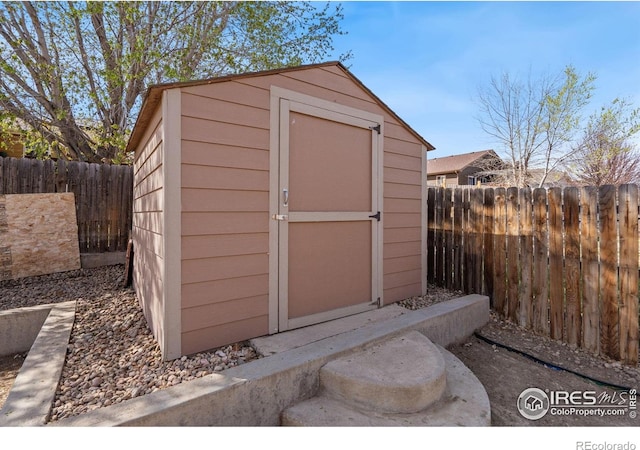 view of shed with a fenced backyard