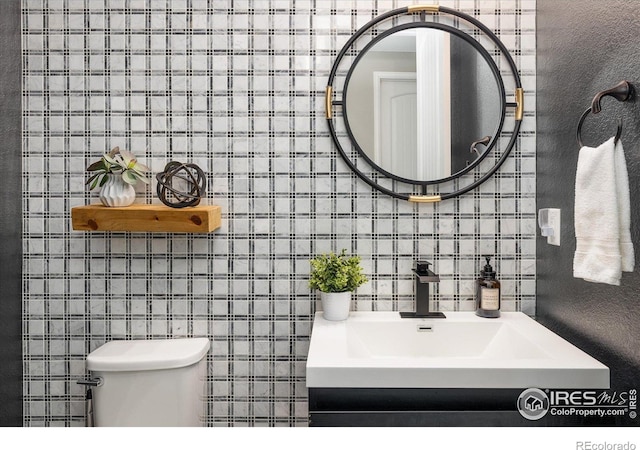 16392 Spanish Peak Way, Broomfield, CO 80023 - bathroom with toilet and a sink