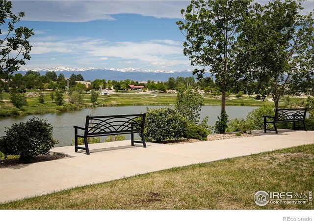 16392 Spanish Peak Way, Broomfield, CO 80023 - surrounding community featuring a water and mountain view and a yard