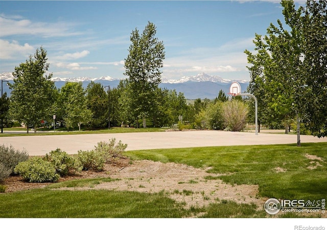 16392 Spanish Peak Way, Broomfield, CO 80023 - view of sport court featuring a mountain view, community basketball court, and a yard