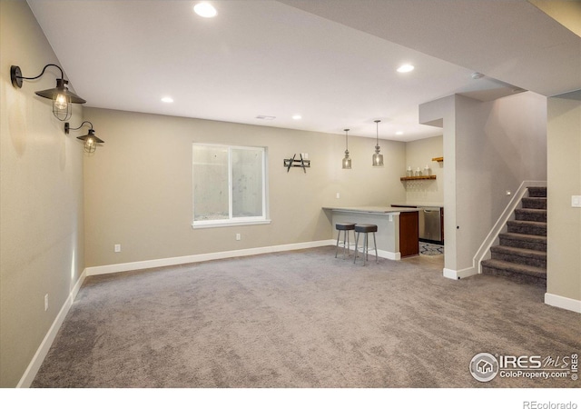 16392 Spanish Peak Way, Broomfield, CO 80023 - unfurnished living room featuring bar area, carpet flooring, recessed lighting, stairs, and baseboards