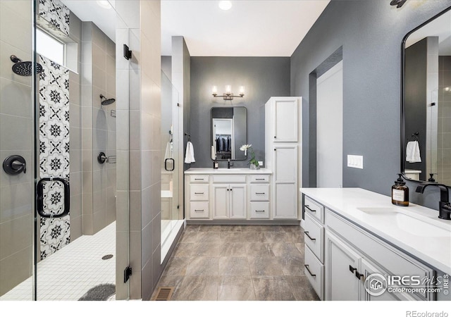 16392 Spanish Peak Way, Broomfield, CO 80023 - bathroom with a shower stall and two vanities