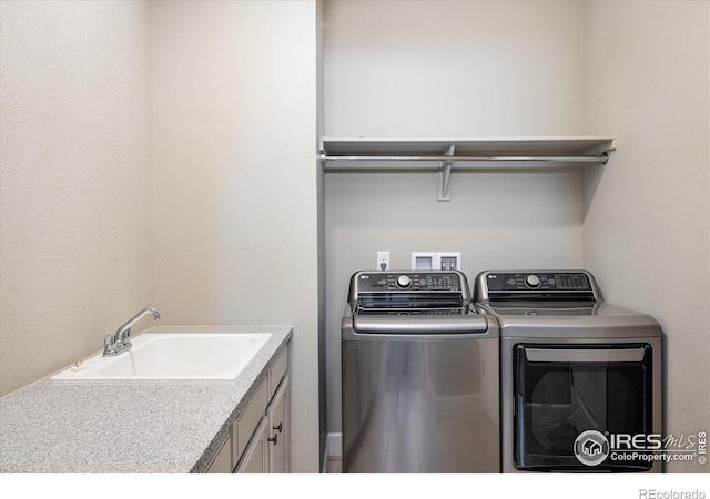 16392 Spanish Peak Way, Broomfield, CO 80023 - laundry area with washing machine and dryer and cabinet space