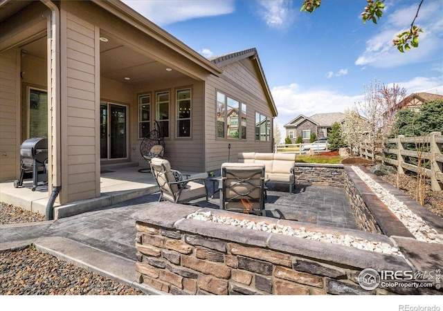16392 Spanish Peak Way, Broomfield, CO 80023 - view of patio / terrace featuring an outdoor living space, fence, and grilling area