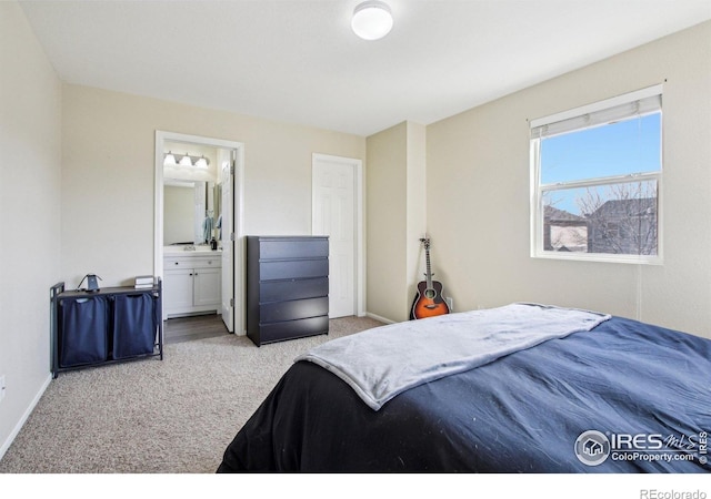 10433 Forester Pl, Longmont, CO 80504 - bedroom with baseboards, ensuite bathroom, and carpet