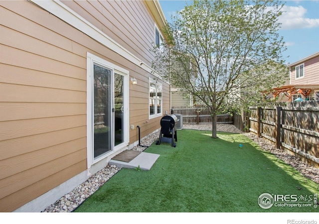 10433 Forester Pl, Longmont, CO 80504 - view of yard with a fenced backyard