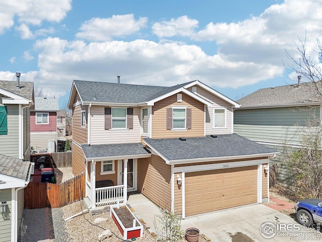 10433 Forester Pl, Longmont, CO 80504 - view of front of property featuring a garage, fence, a shingled roof, a porch, and driveway