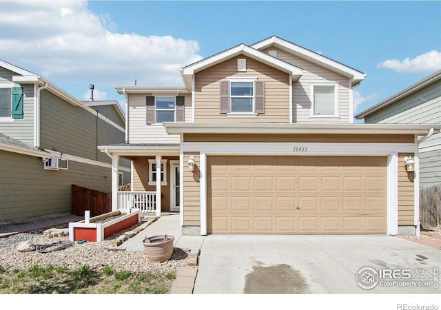 10433 Forester Pl, Longmont, CO 80504 - traditional-style home featuring a porch, driveway, and a garage