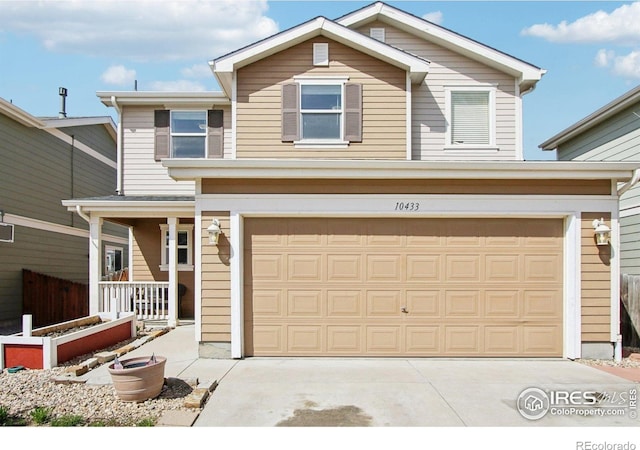 10433 Forester Pl, Longmont, CO 80504 - traditional-style home with a porch, an attached garage, and driveway