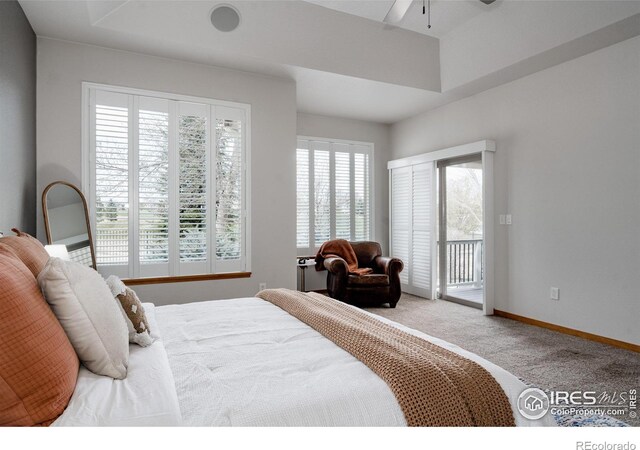 6771 Crooked Stick Dr, Windsor, CO 80550 - carpeted bedroom featuring access to exterior, ceiling fan, and baseboards