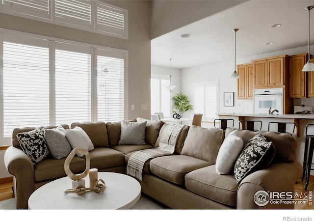 6771 Crooked Stick Dr, Windsor, CO 80550 - living area with recessed lighting and wood finished floors