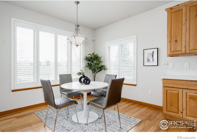 6771 Crooked Stick Dr, Windsor, CO 80550 - dining space featuring light wood-style flooring and baseboards