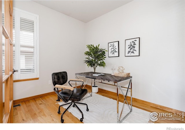 6771 Crooked Stick Dr, Windsor, CO 80550 - office area featuring baseboards and wood finished floors