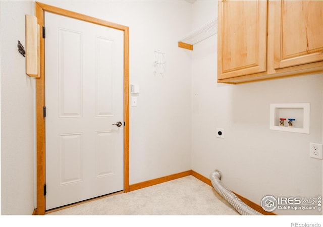 6771 Crooked Stick Dr, Windsor, CO 80550 - laundry area with cabinet space, electric dryer hookup, carpet, hookup for a washing machine, and baseboards