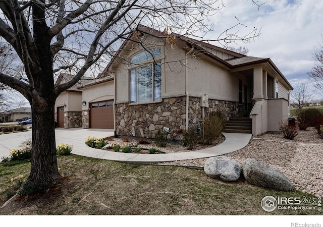 6771 Crooked Stick Dr, Windsor, CO 80550 - view of side of property featuring stone siding, driveway, an attached garage, and stucco siding