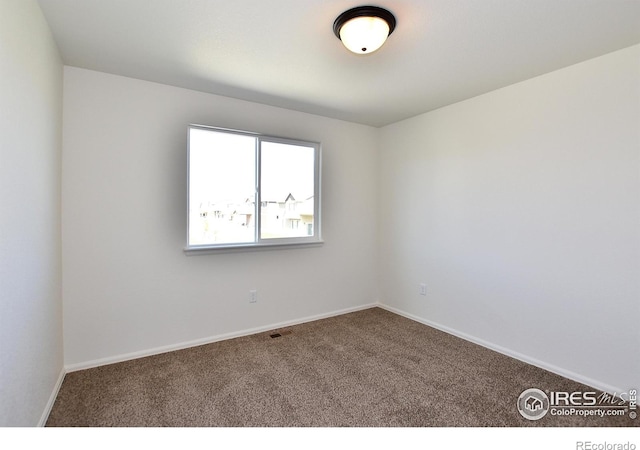 8606 8th St, Greeley, CO 80634 - carpeted empty room featuring visible vents and baseboards