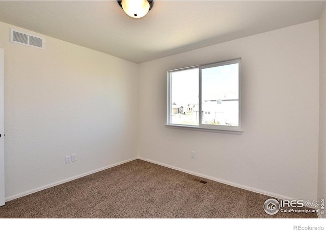 8606 8th St, Greeley, CO 80634 - empty room featuring carpet flooring, baseboards, and visible vents