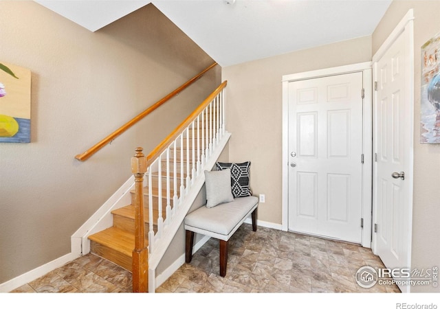 658 Casper Dr, Lafayette, CO 80026 - entrance foyer with baseboards and stairs