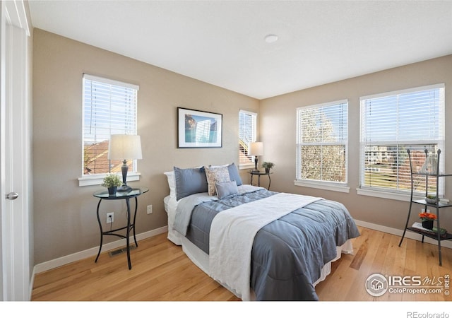 658 Casper Dr, Lafayette, CO 80026 - bedroom with baseboards and wood finished floors