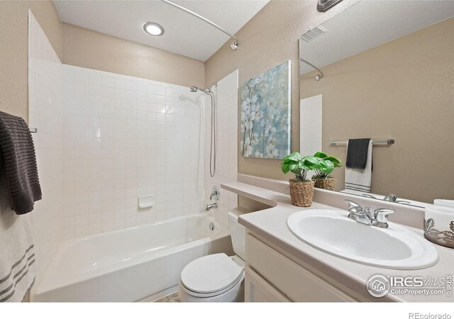 658 Casper Dr, Lafayette, CO 80026 - full bathroom featuring bathtub / shower combination, vanity, and toilet