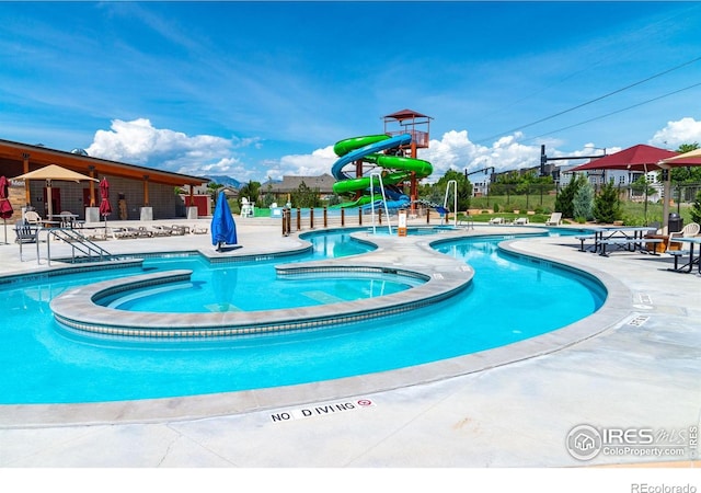 658 Casper Dr, Lafayette, CO 80026 - community pool featuring a jacuzzi, a patio area, and a water slide