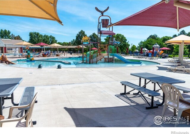 658 Casper Dr, Lafayette, CO 80026 - community pool with a water play area, a water slide, and a patio area
