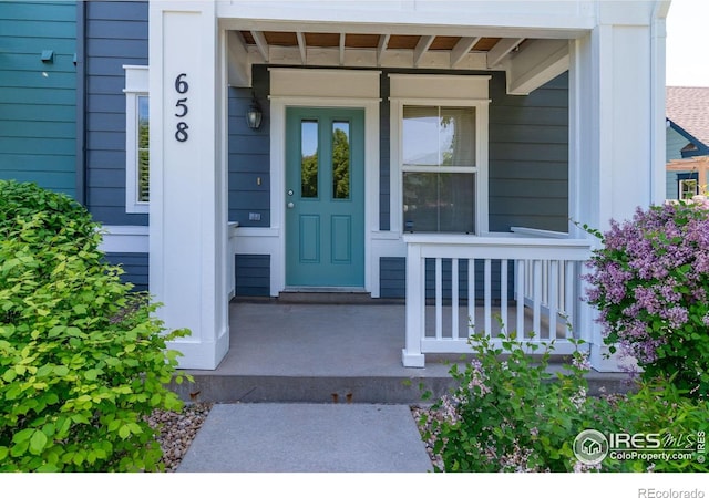 658 Casper Dr, Lafayette, CO 80026 - view of exterior entry with a porch