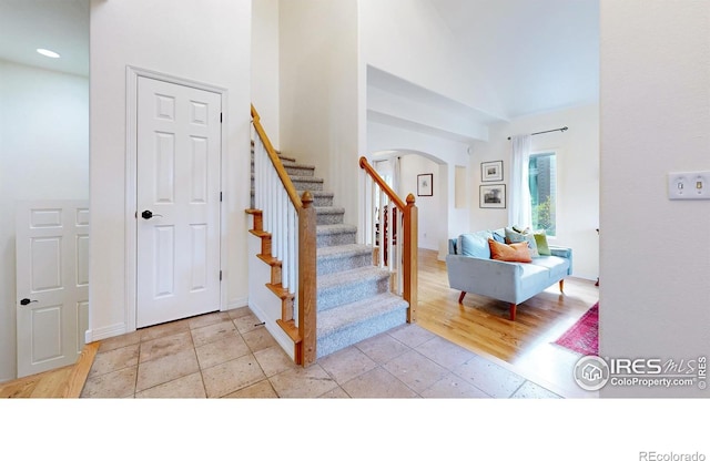 5105 Nelson Ct, Fort Collins, CO 80528 - staircase with baseboards, recessed lighting, and arched walkways