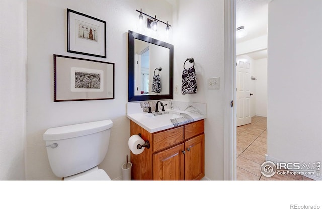 5105 Nelson Ct, Fort Collins, CO 80528 - half bath featuring tile patterned flooring, vanity, and toilet