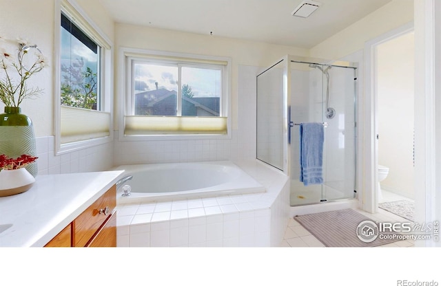 5105 Nelson Ct, Fort Collins, CO 80528 - bathroom with toilet, a shower stall, vanity, tile patterned floors, and a garden tub