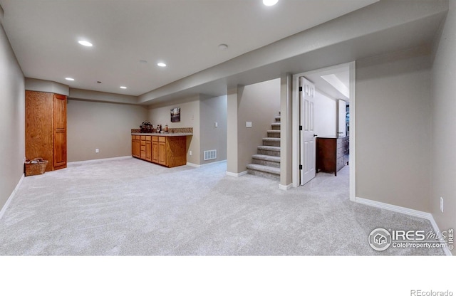 5105 Nelson Ct, Fort Collins, CO 80528 - finished below grade area featuring light carpet, recessed lighting, indoor wet bar, and visible vents