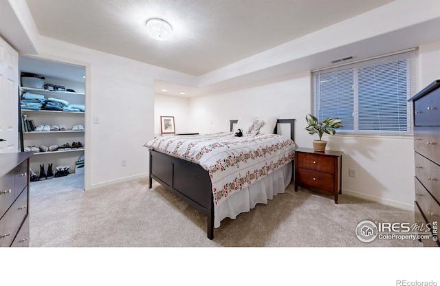 5105 Nelson Ct, Fort Collins, CO 80528 - bedroom featuring a spacious closet, visible vents, baseboards, and carpet