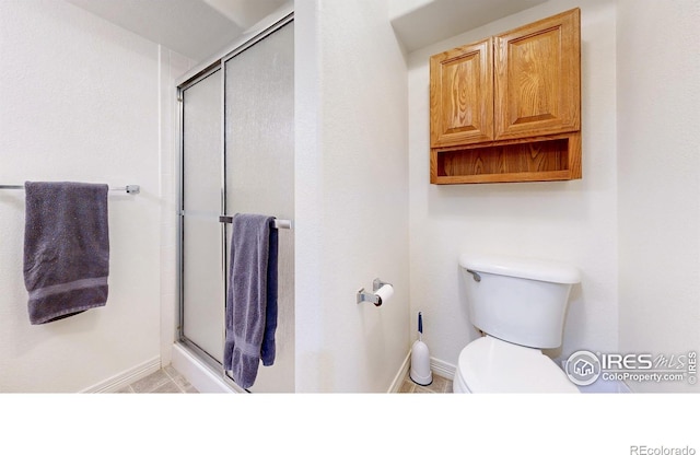 5105 Nelson Ct, Fort Collins, CO 80528 - bathroom with an enclosed shower, baseboards, and toilet