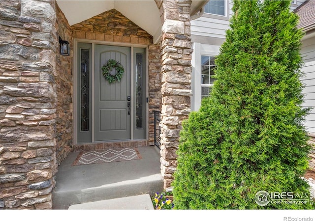 7225 Royal Country Down Dr, Windsor, CO 80550 - doorway to property with stone siding