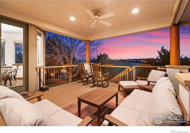 7225 Royal Country Down Dr, Windsor, CO 80550 - deck at dusk featuring outdoor lounge area and a ceiling fan