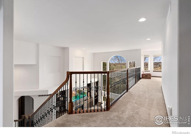 7225 Royal Country Down Dr, Windsor, CO 80550 - corridor with carpet flooring, recessed lighting, and arched walkways